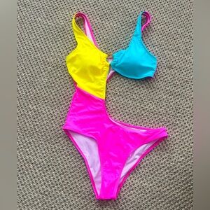 Kamoni Color Block O-ring V Neck Cut Out High Leg Cut Cheeky One Piece Swimsuit